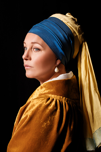 Studio portrait of a girl with a pearl earring