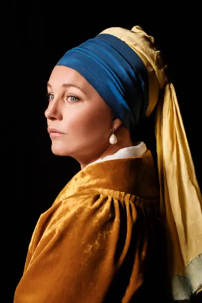 Studio portrait of a girl with a pearl earring