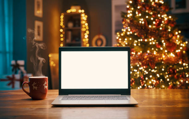 istock Laptop with blank screen and Christmas tree 1282099926