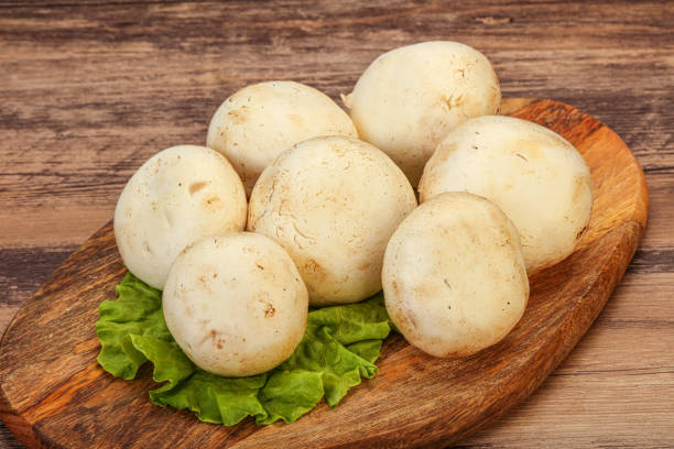 istock Raw mushrooms over the board 1282105248