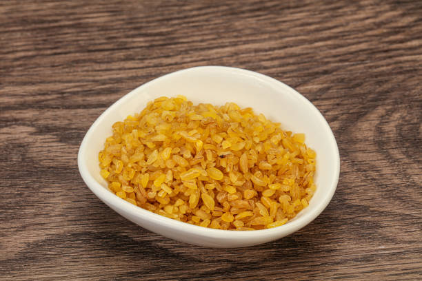 istock Vegetarian cuisine - dry bulgur for cooking 1282105304