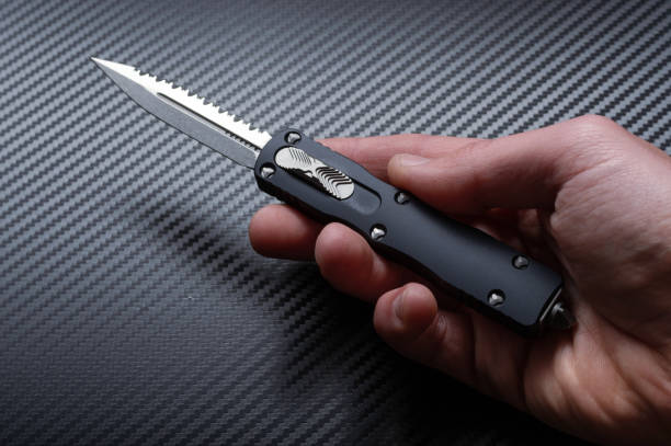 Small compact knife in hand. Knife open in hand. Small compact knife in hand. Knife open in hand. Top. switchblade stock pictures, royalty-free photos & images