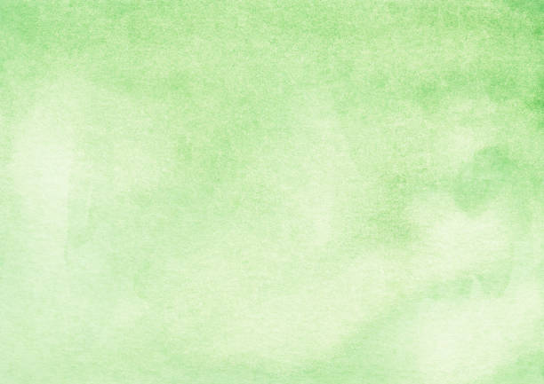 istock Watercolor light green background texture. Aquarelle green-yellow gradient backdrop. 1282106550