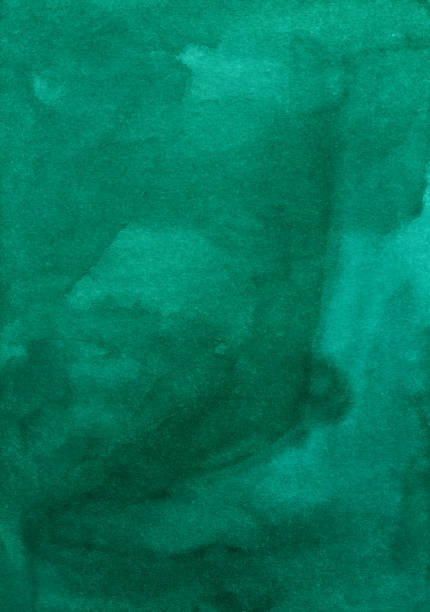 istock Watercolor deep green background texture. Aquarelle abstract emerald backdrop. Stains on paper. 1282106579