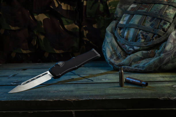 istock Sharp knife and cartridges. Army uniform, knives and casings. 1282108494