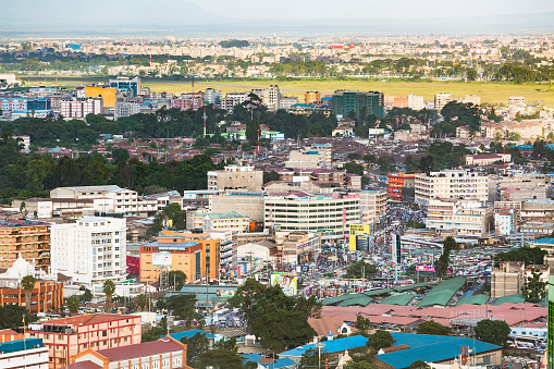 Nairobi, Kenya - December 23: View to the large bus terminal and market at Landhies Road in the east of Nairobi, Kenya, with Eastleigh Airfield in the background on December 23, 2015