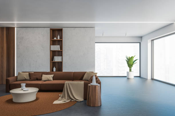 istock Concrete and brown living room with window 1282112300