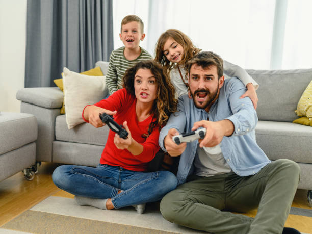 istock Family playing video games at home 1282113151