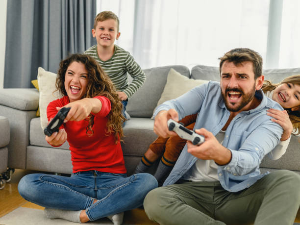 istock Family playing video games at home 1282113662