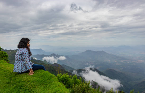 istock Girl Isolated soaking natural beauty from hill top 1282113949