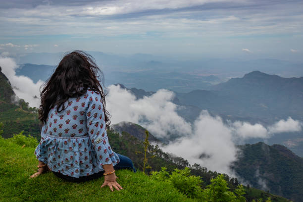 istock Girl Isolated soaking natural beauty from hill top 1282114520