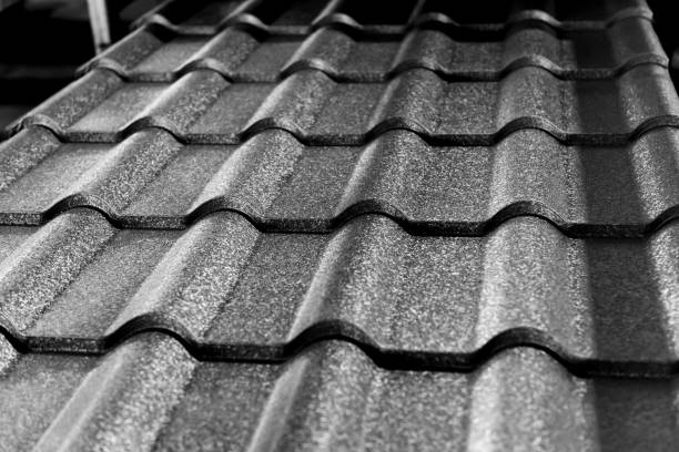 istock Gray metallic roof tiles background with light pattern. 1282114759