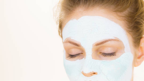 istock Girl green mud mask on face 1282116371