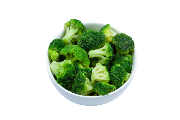 istock Frozen broccoli florets in a bowl isolated on white background, top view 1282119060