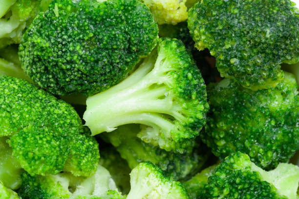 istock Frozen broccoli florets close up, top view 1282119078