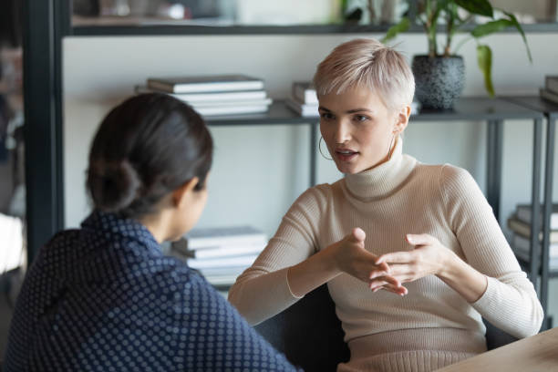 istock Diverse female colleagues brainstorm discuss ideas in office 1282120107
