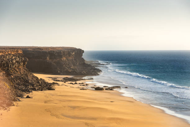 coast in fuerteventura at el cotillo in the canary islands, spain - el cotillo imagens e fotografias de stock