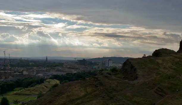 Photo of Sunbeams in a dull evening sky over Edinburgh (Scotland) seen from Arthur's Seat