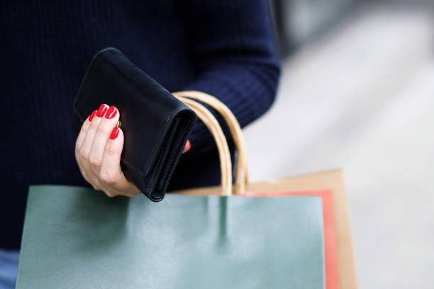 istock A woman with a wallet Ready for online shopping 1282129428