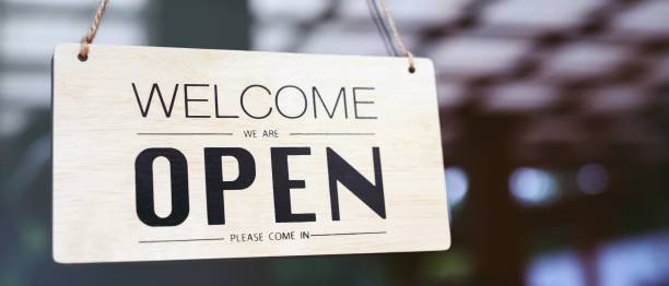 istock Coffee shop woman owner with face mask, open after lockdown quarantine. 1282129798
