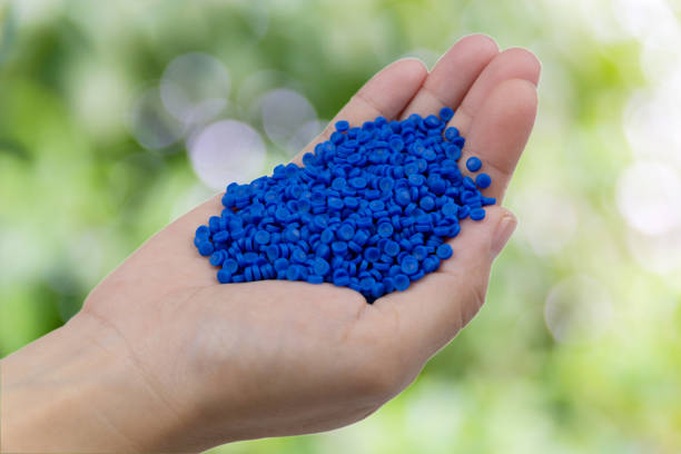 istock Close-up of plastic polymer granules. hand hold Polymer pellets. polymer plastic. compound polymer. 1282134208