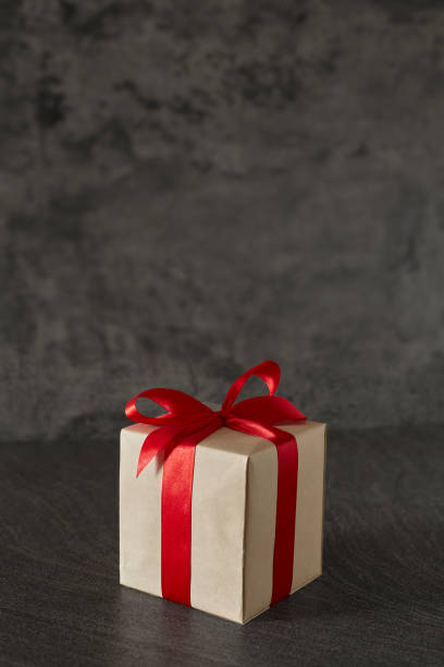 istock gift box ribbon bow on grunge background and space for text 1282135942