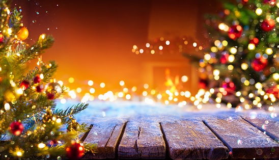Wooden Table With Snow And Defocused Christmas Tree - Abstract Background