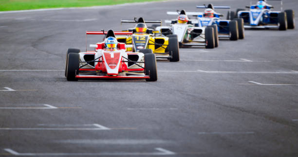 istock Drivers driving racing cars 1282139219