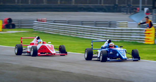 istock Drivers driving racing cars 1282139220