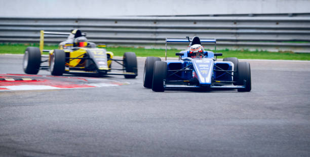 istock Drivers driving racing cars 1282139253