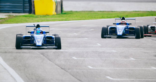 istock Drivers driving racing cars 1282139293
