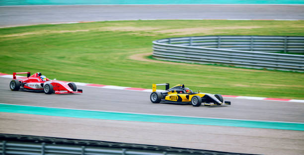istock Drivers driving racing cars 1282139296