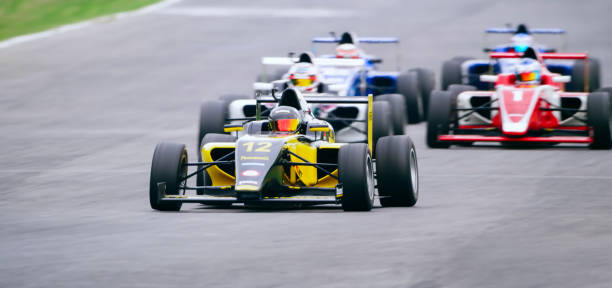 istock Drivers driving racing cars 1282139318