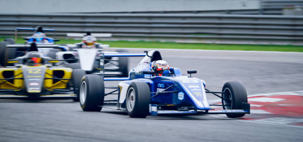istock Drivers driving racing cars 1282139319