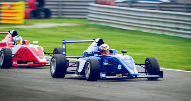 istock Drivers driving racing cars 1282139324