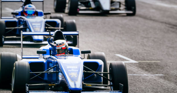 istock Drivers driving racing cars 1282139369