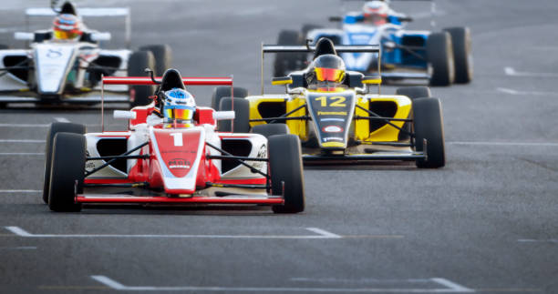 istock Drivers driving racing cars 1282139382