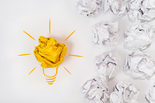 Sketch of a light bulb with a paper ball. Concept for innovation, creativity and inspiration