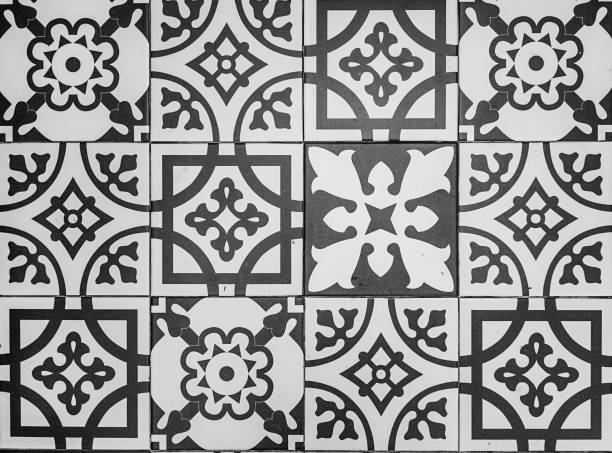istock Tiles. Tiles floor with flower patterns processed in black and white style. 1282140825