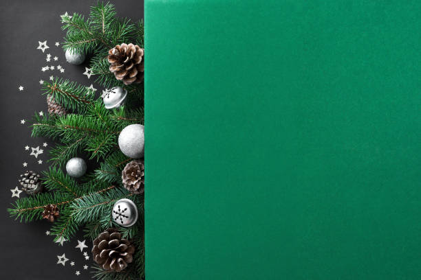 Christmas composition Christmas composition. Christmas decor, pine branches and cones on multilayer green and black background. Top view, copy space. pinaceae photos stock pictures, royalty-free photos & images