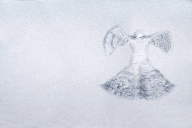 Snow angel made in the white snow Snow angel made in the white snow snow angels stock pictures, royalty-free photos & images