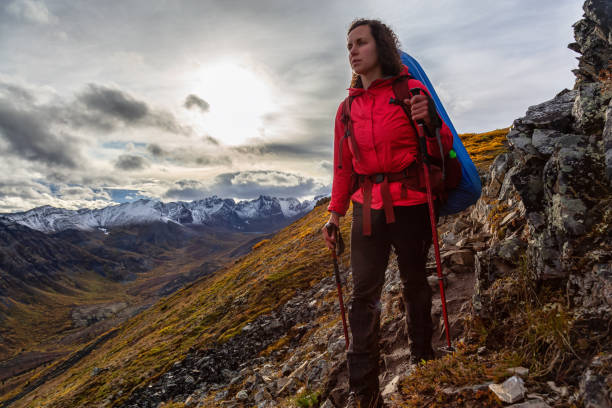 istock Woman Backpacking in Scenic Mountain Landscape 1282144409