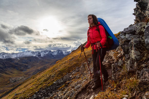 istock Woman Backpacking in Scenic Mountain Landscape 1282144410
