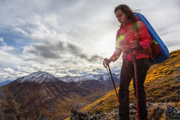 istock Woman Backpacking in Scenic Mountain Landscape 1282144498