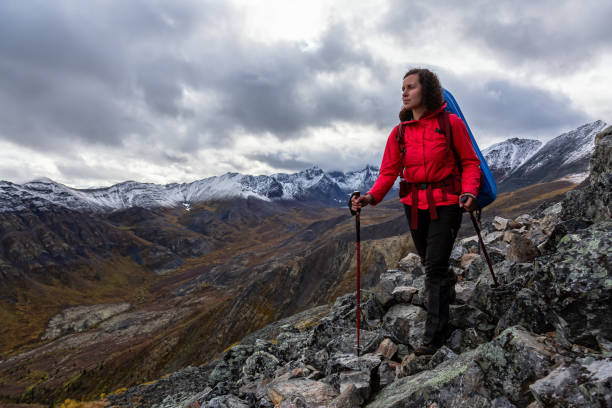 istock Girl Backpacking along Scenic Hiking Trail 1282145126