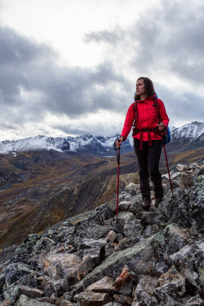 istock Girl Backpacking along Scenic Hiking Trail 1282145139