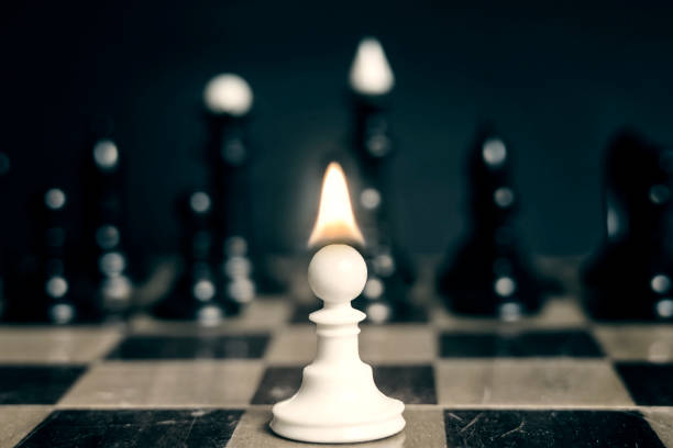Single pawn with flame tongue on head against many enemies