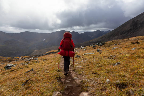 istock Woman Backpacking on Scenic Rocky Hiking Trail 1282147875