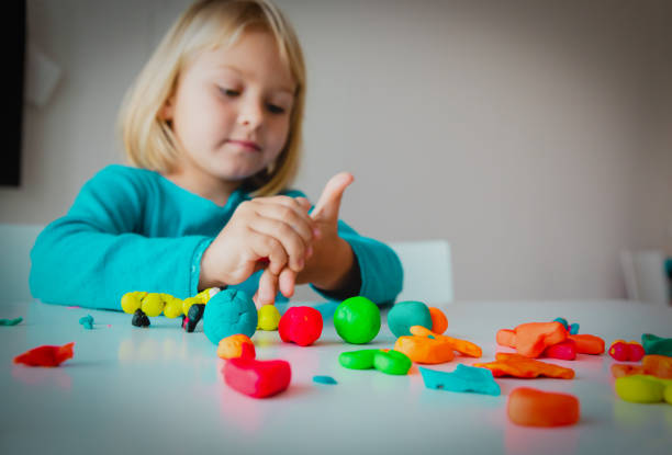 istock Child playing with clay molding shapes, kids crafts 1282149459
