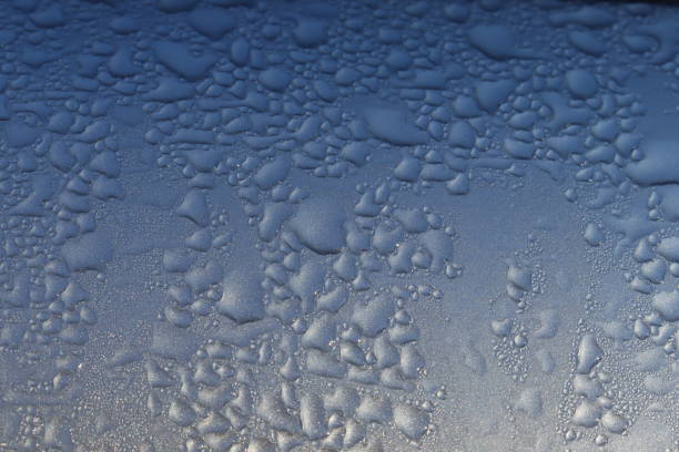istock A gradiently brightening close up of a wet silver surface 1282150389